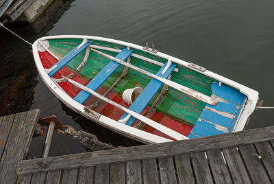 High angle view of fishing boat moored at pier