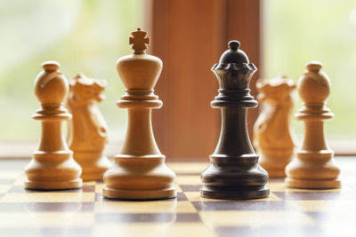 Close-up of chess pieces on chess board