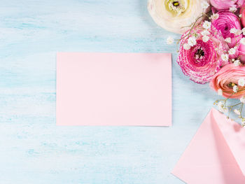 High angle view of pink rose on table