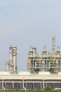 Low angle view of factory against clear sky