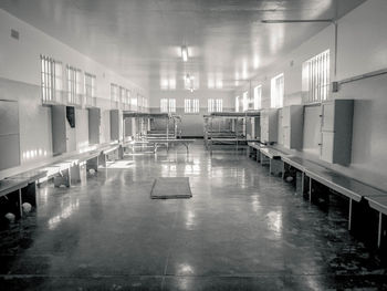 A large and cold room in robben island prison that was used as a dormitory for prisoners.