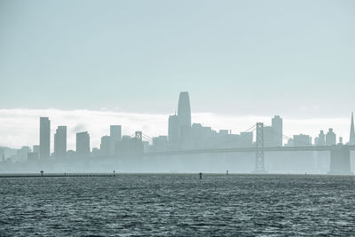 Beautiful view of bay bridge and skyline with clear sky in background