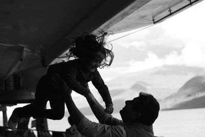 Close-up of woman standing against sky