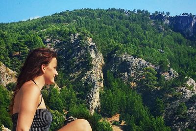 Woman relaxing on mountain