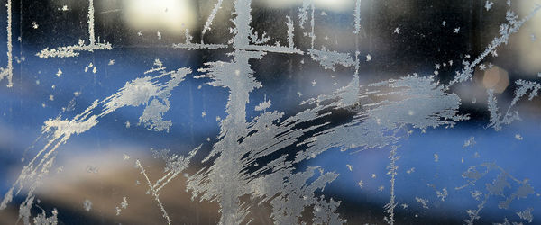 Full frame shot of icicles on glass window