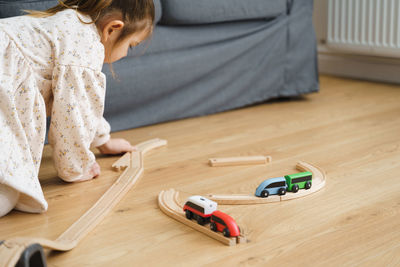 Girl playing with toy at home