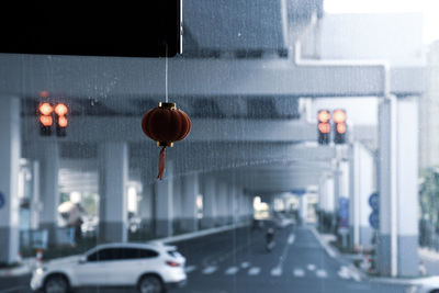 Street lights hanging from car on road in city