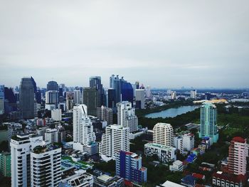 High angle view of modern buildings in city against sky