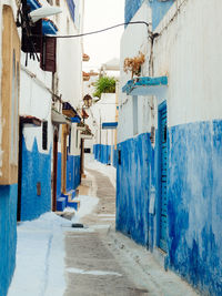 Narrow alley amidst buildings in town