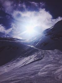 Scenic view of landscape against sky during winter