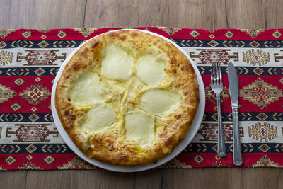 High angle view of pizza on table
