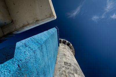Low angle view of swimming pool against blue sky