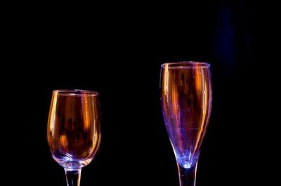 Close-up of wine glasses on glass