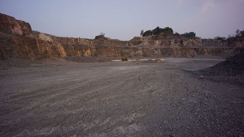 Scenic view of arid landscape against clear sky