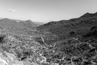 Scenic view of arid landscape against sky