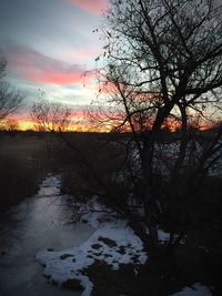 Scenic view of lake at sunset