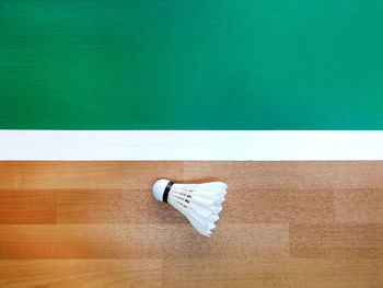 High angle view of umbrella on wooden floor