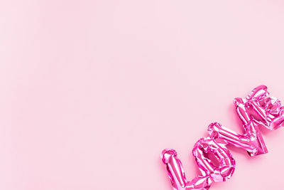 Close-up of pink flowers over white background