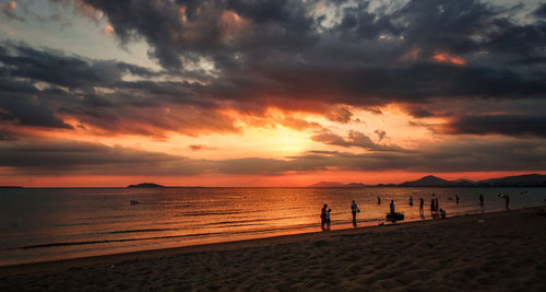 Scenic view of beach against sky during sunset