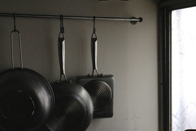 Close-up of kitchen utensils hanging at home