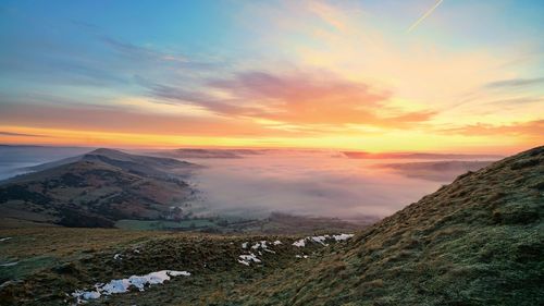 Scenic view of landscape against sky during sunset