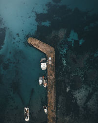 Aerial view of boat moored at jetty