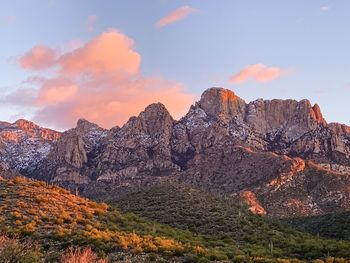 Scenic view of rocky mountains against sky during sunset