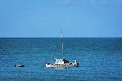 Sailboat sailing in sea