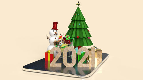 Close-up of christmas decorations against white background