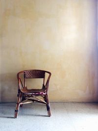 Empty chair in abandoned room