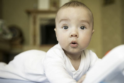 Portrait of cute baby boy at home