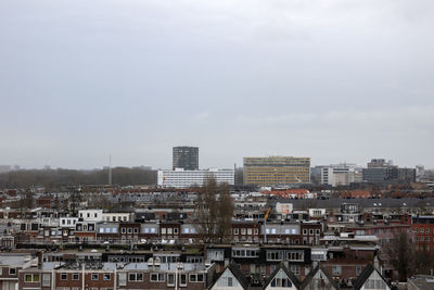 High angle view of buildings in city against sky