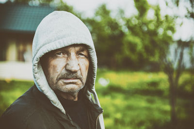 Close-up portrait of man in hood