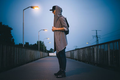 Full length of woman standing against sky