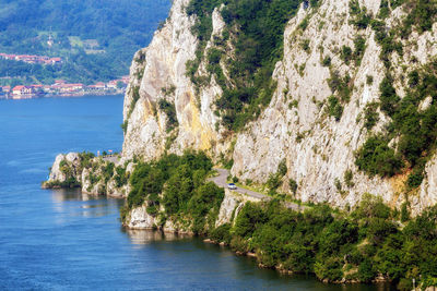 Scenic view of sea by mountains