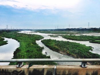 Scenic view of river with trees in background