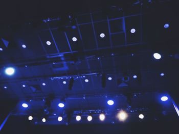 Low angle view of illuminated lighting equipment