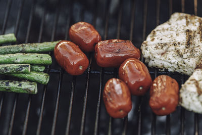 High angle view of meat on barbecue grill