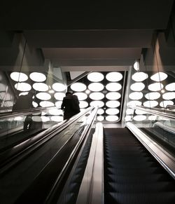 People walking on escalator