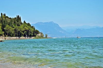 Scenic view of sea against clear blue sky