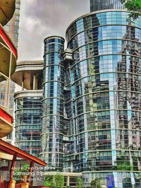 Low angle view of modern buildings against sky