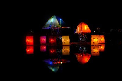 Illuminated lighting equipment against clear sky at night