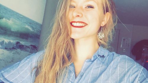 Beautiful young woman at home