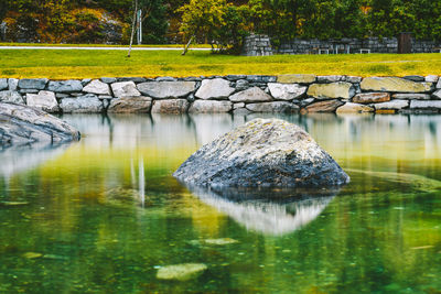 Reflection of rocks in lake