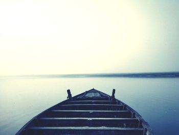 Pier over sea against clear sky