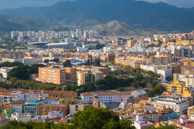 High angle view of townscape against mountains