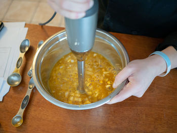 High angle view of person preparing food on table