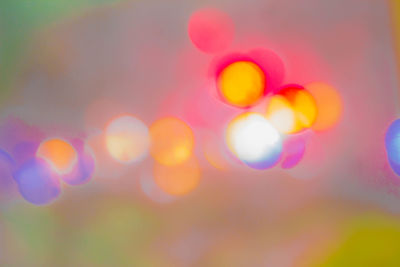 Defocused lights against sky at night