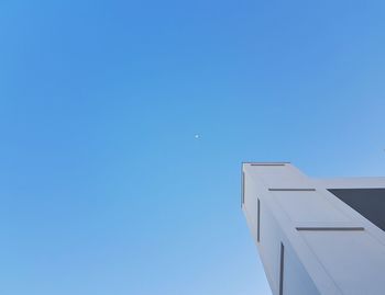 Low angle view of building against clear blue sky