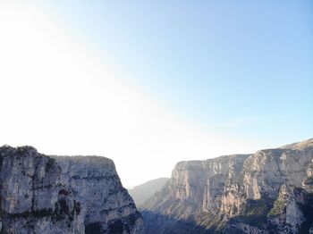 Scenic view of rocky mountains against clear sky